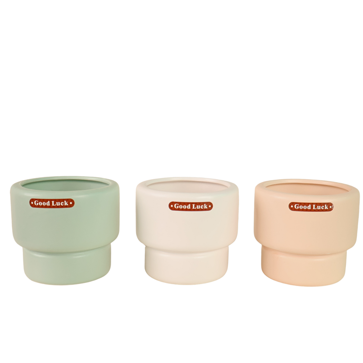 Assorted serveware including porcelain cup and plastic kitchen utensil.