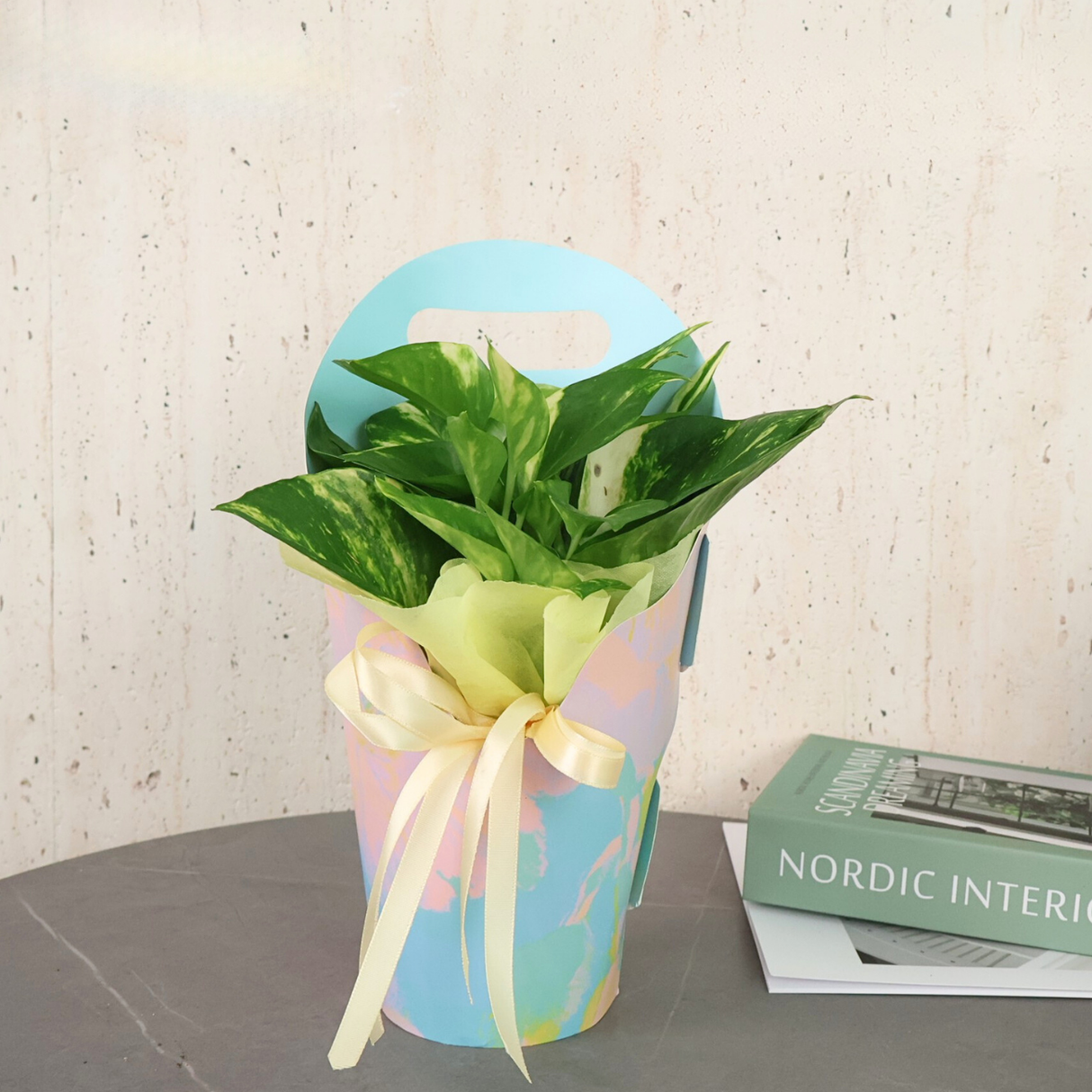 Flower bouquet in vase with paper and artificial flowers.