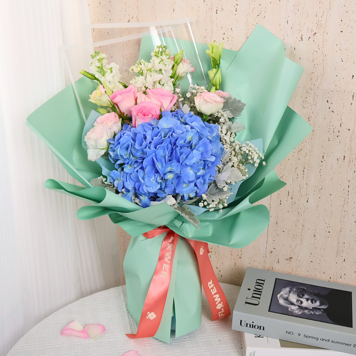 Pink flower bouquet with petals, no faces.