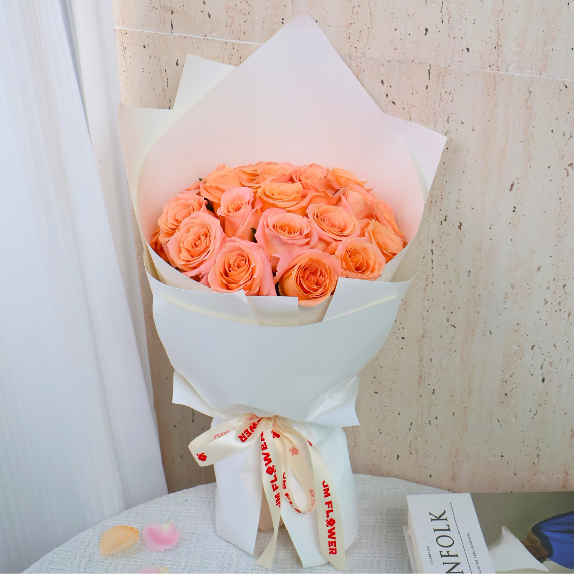Colorful garden rose bouquet with orange and pink petals.