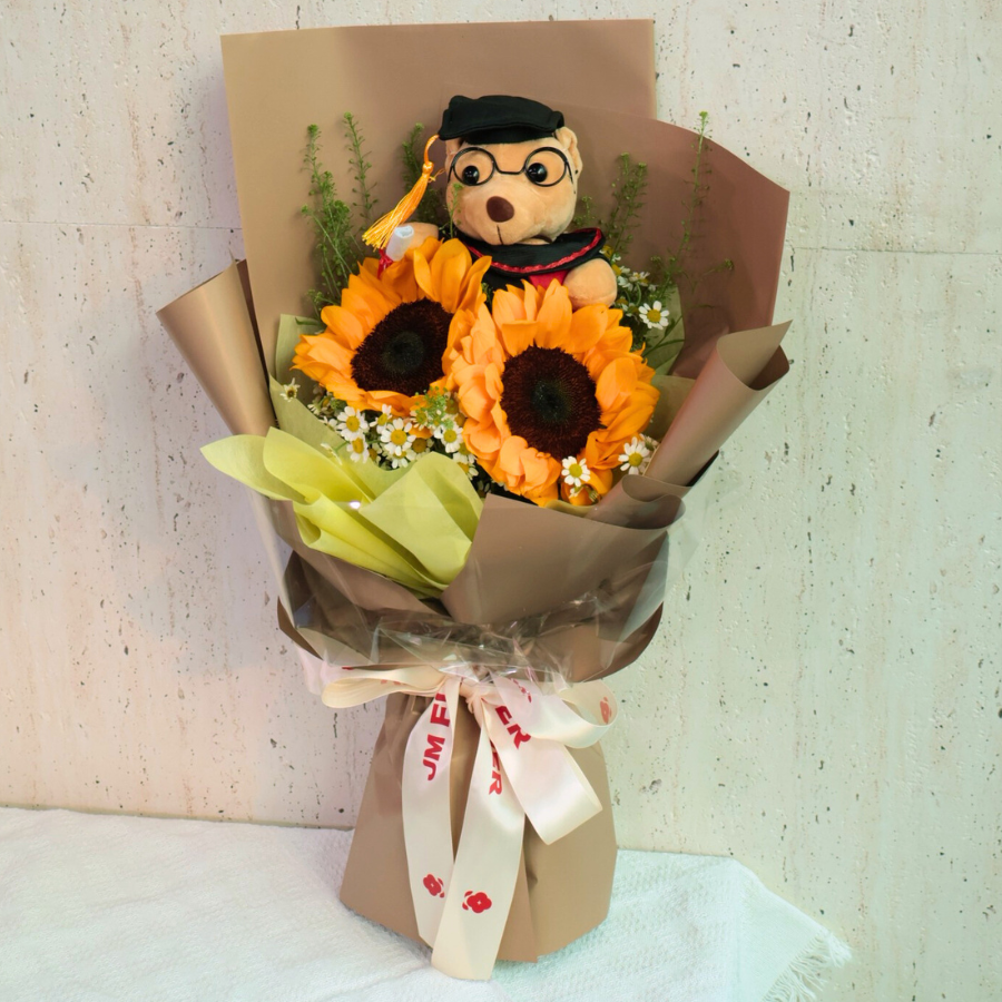 Pink and purple flower bouquet in vase.