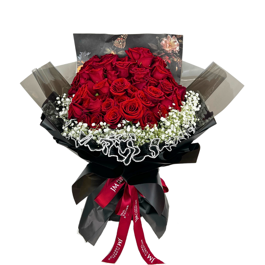 Bouquet of red garden roses and artificial flowers.