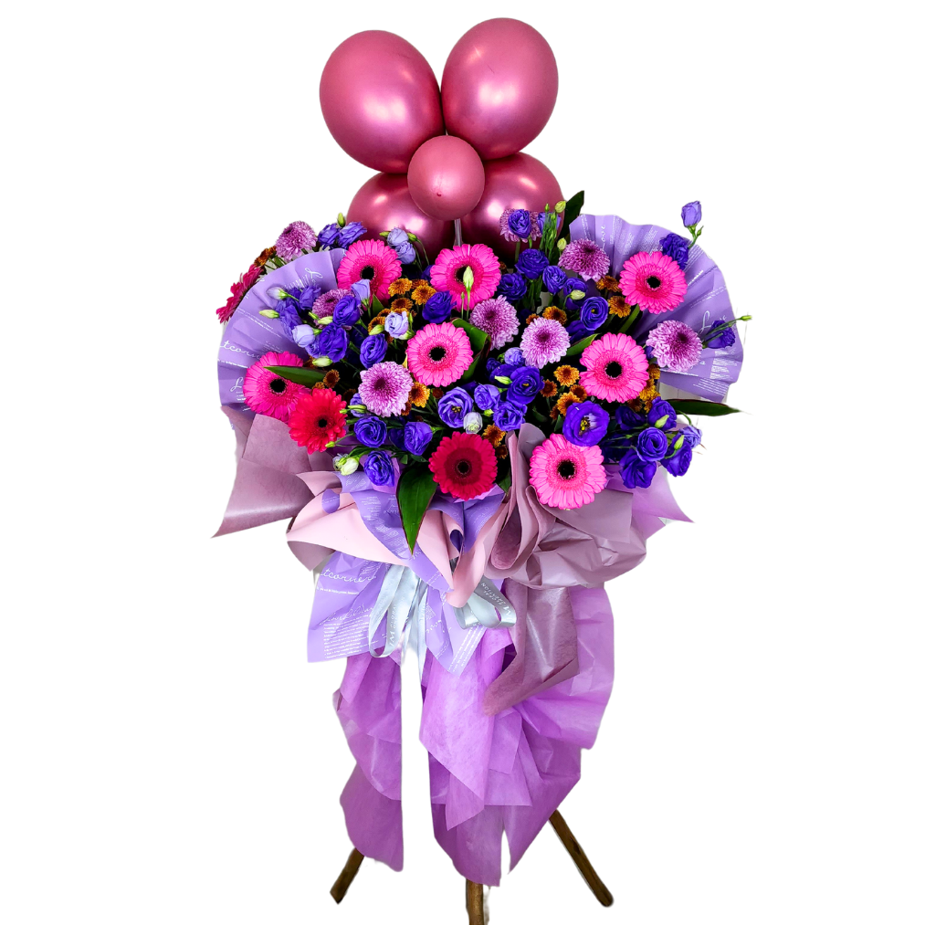 Colorful flower bouquet with pink and purple roses.