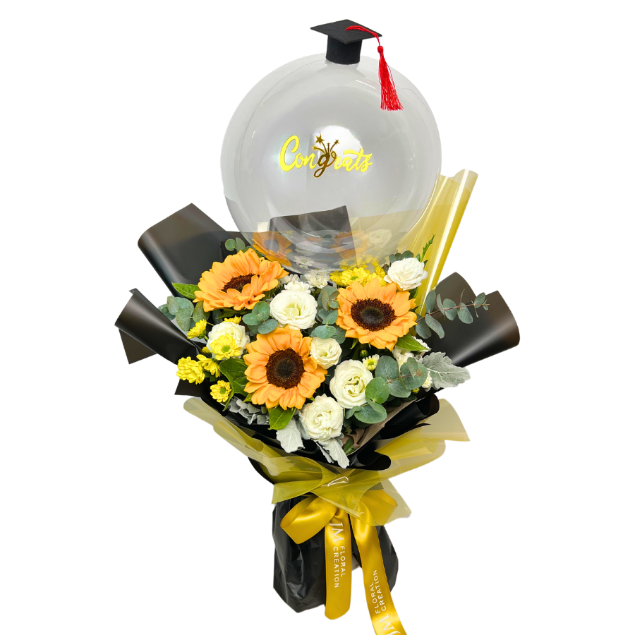 Yellow artificial flower bouquet with various floristry elements.
