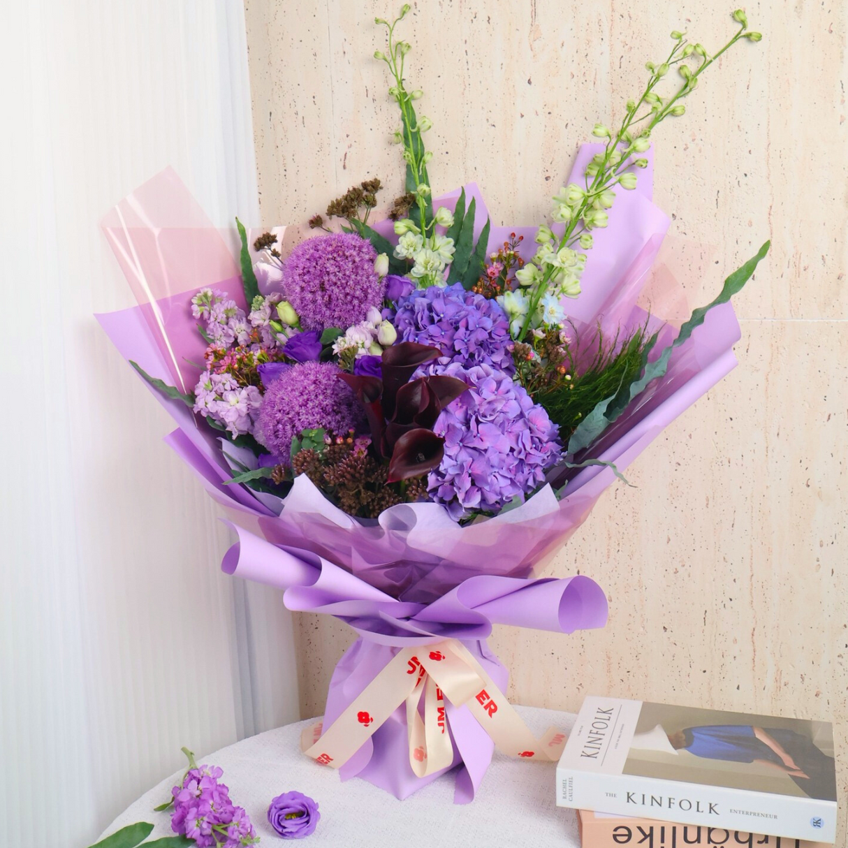 Kinfolk floral bouquet in pink and purple.