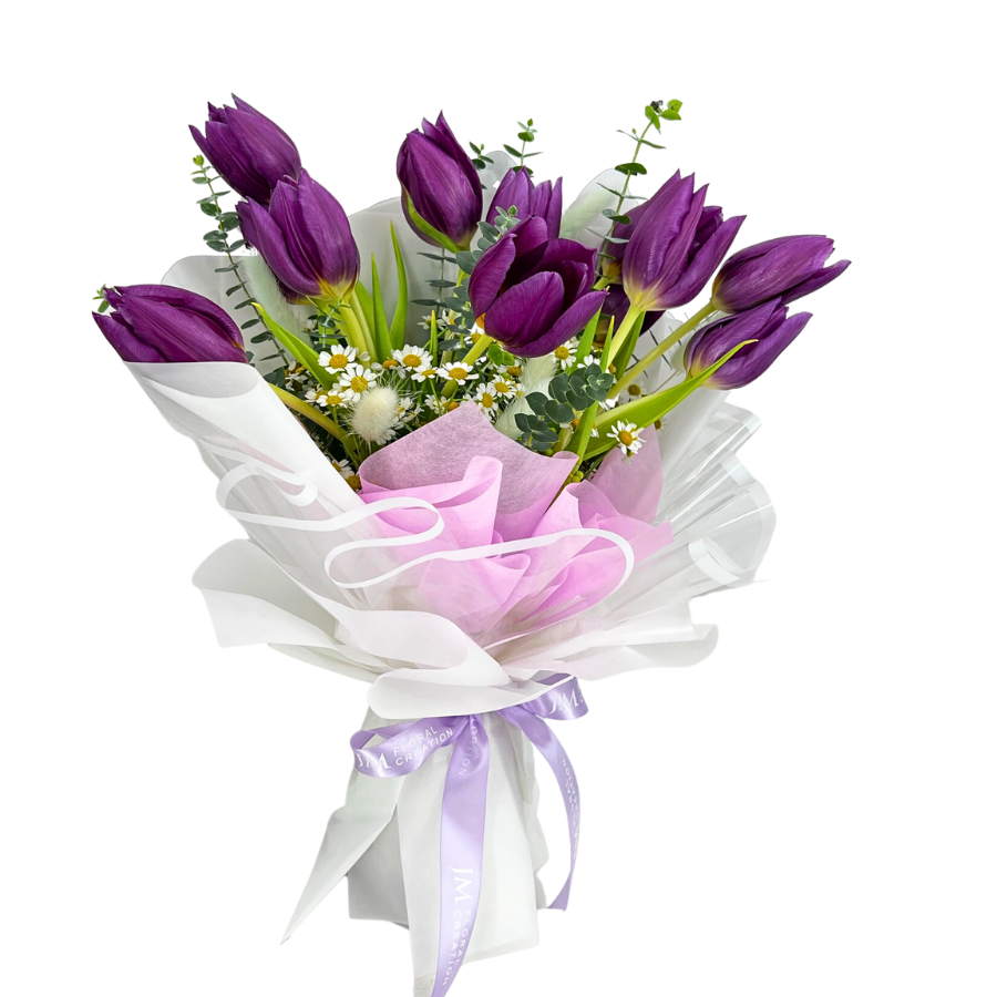 Pink and purple flower bouquet in vase.