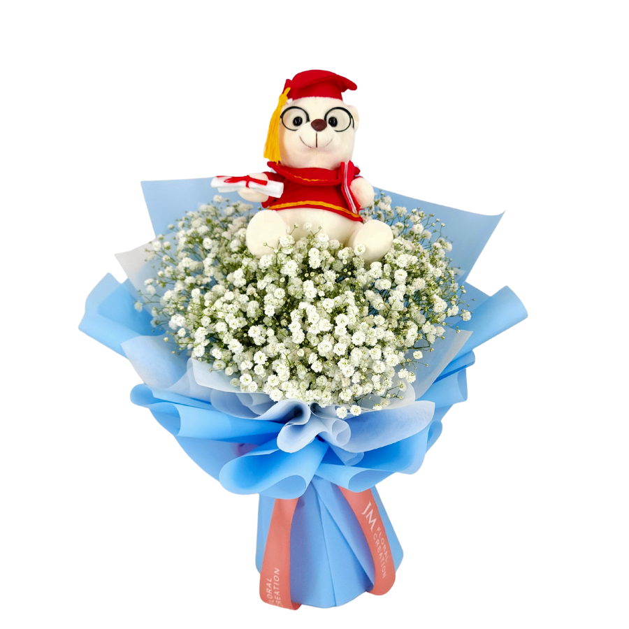 Pink flower bouquet with stuffed toy.