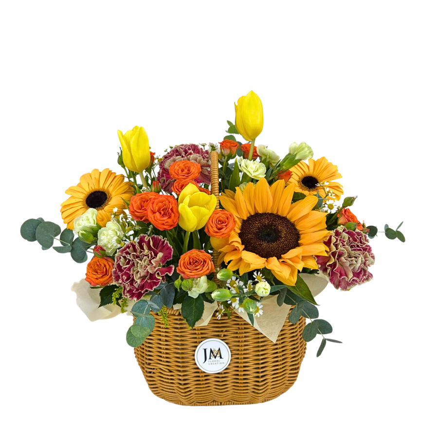 Yellow flower bouquet in basket with "JM".