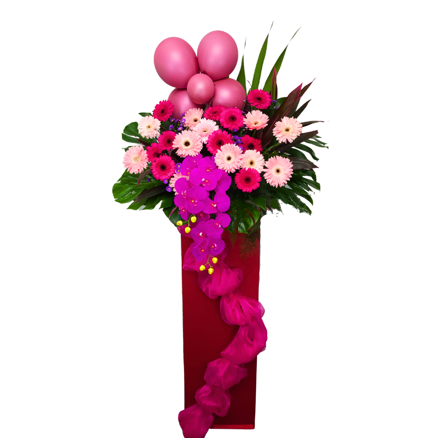 Pink and purple flower bouquet in vase.