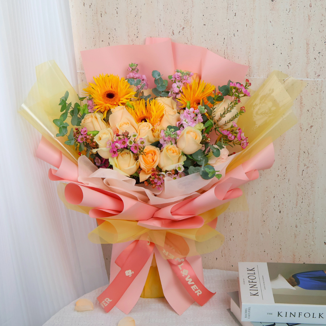 Yellow and pink artificial flower bouquet by Kinfolk.