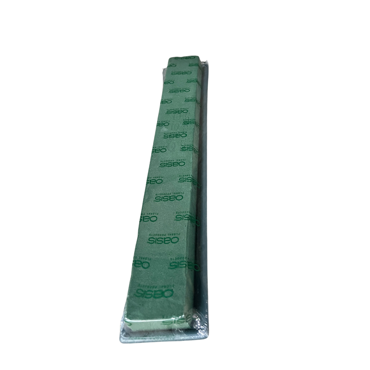 Plastic ruler on natural material sleeping pad.