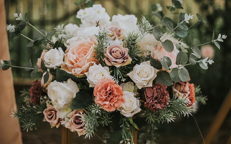 Affordable wedding bouquet with pink, blush, and white roses.