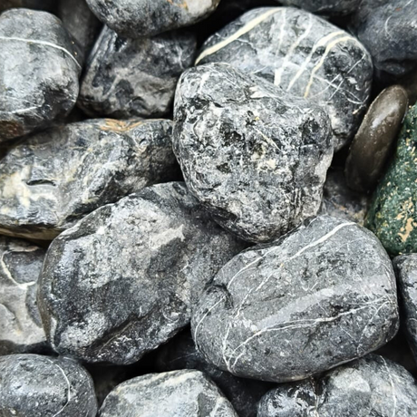 Rock and gravel bedrock with rubble and pebbles.
