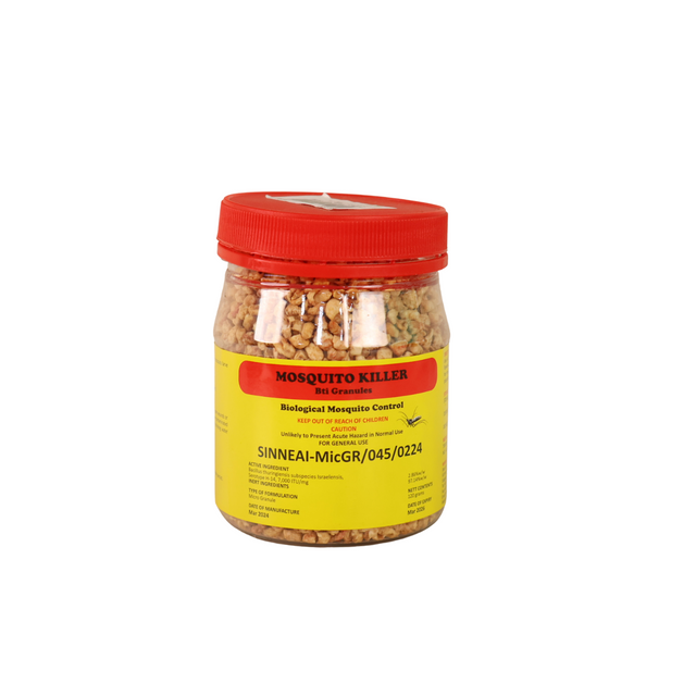 Bottled mosquito killer Bti granules with caution label.