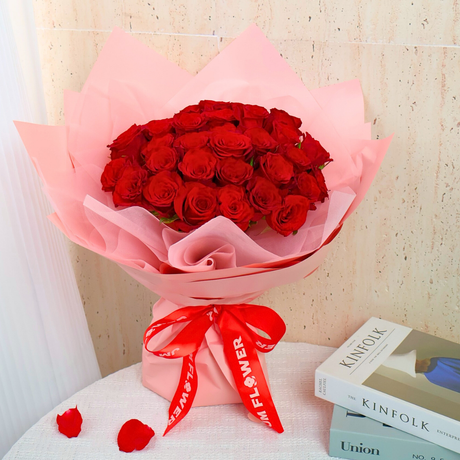 Red garden rose flower bouquet with pink petals.