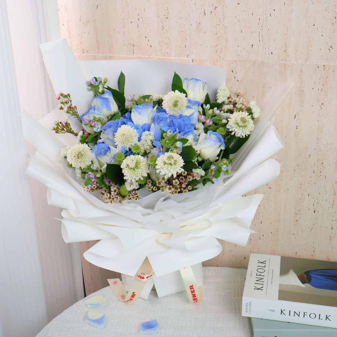 Flower bouquet with garden roses and artificial flowers.