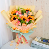 Yellow and pink flower bouquet by Kinfolk.