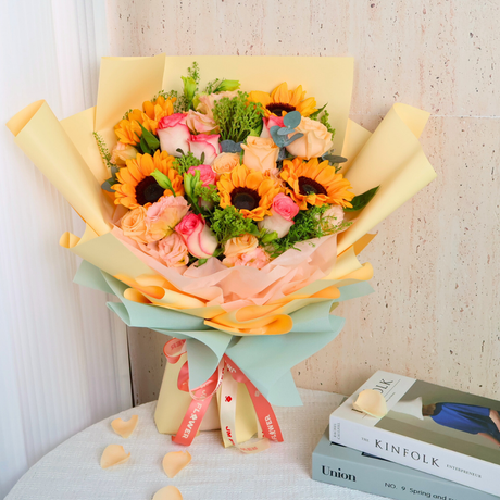 Yellow and pink flower bouquet by Kinfolk.