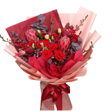 Crimson Charm (10 Roses, 5 Eustoma, 2 Protea Pink) - Flower Bouquet