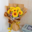 Yellow common sunflower bouquet with "Love" visible.