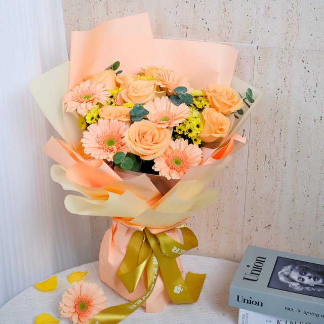 Colorful flower bouquet with yellow, pink, and orange petals.