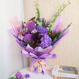 Kinfolk floral bouquet in pink and purple.