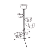 Geraniums in flowerpot on furniture.