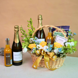 Wine bottle and glass bottle on basket with alcohol.
